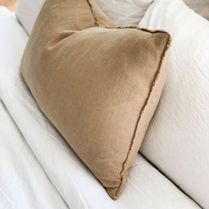 Brown pillow on a white sofa
