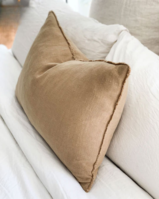 Brown pillow on a white sofa