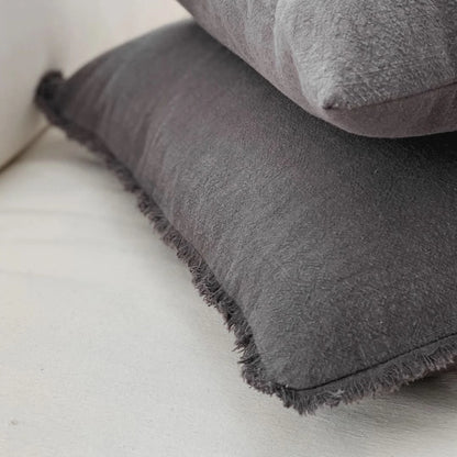 Charcoal Gray textured pillows on a light-colored sofa