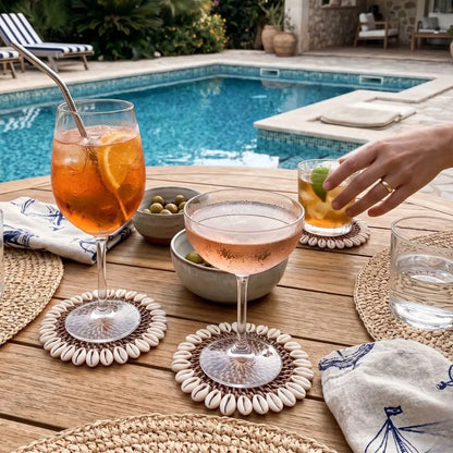 Outdoor setting with drinks on a table by a pool