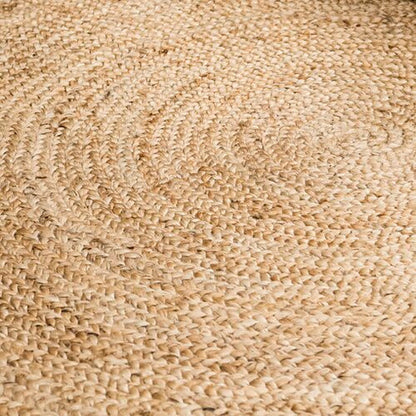 Close-up of a braided natural jute rug