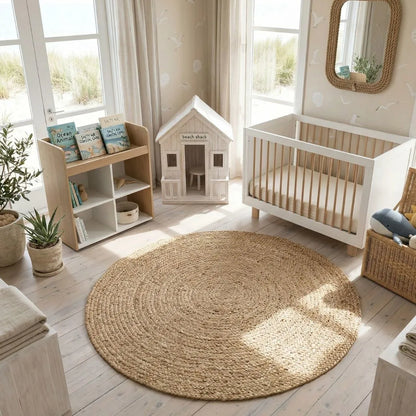 Nursery room with round jute rug, crib, and children's books.