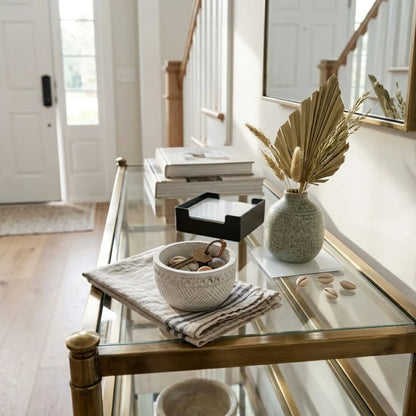 Glass coffee table with decorative items in a home setting