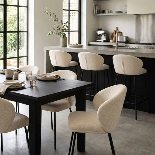 Modern kitchen with a dining table and chairs, and a kitchen island.