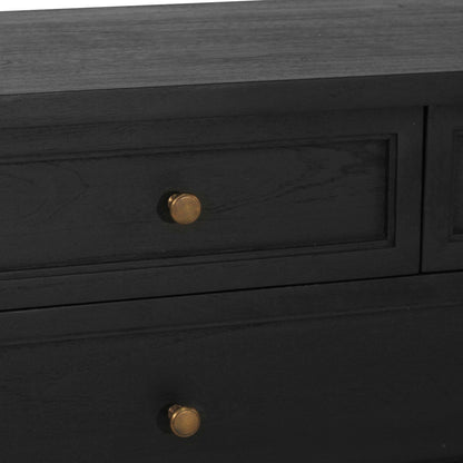 Black wooden dresser with gold knobs on a dark background