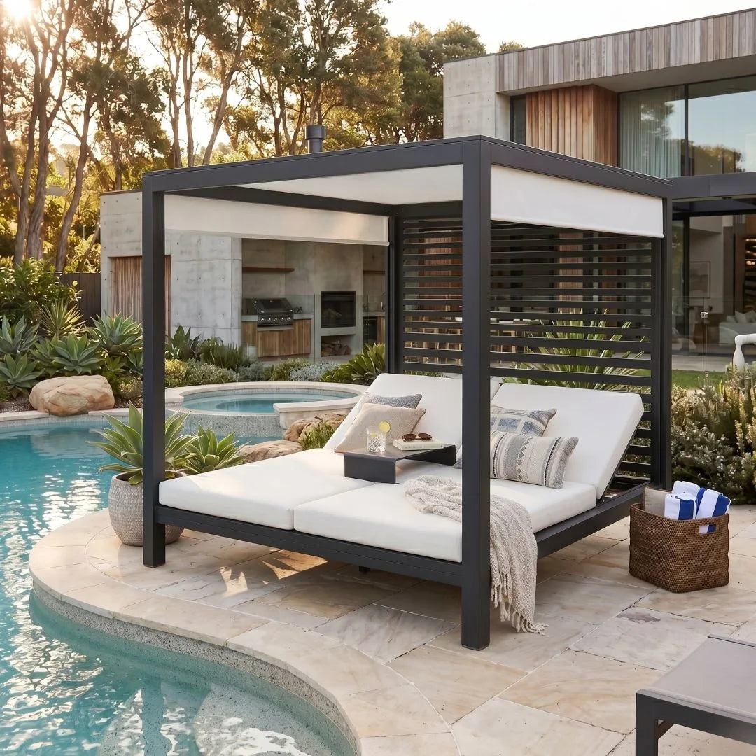 Outdoor lounge bed with canopy by a poolside in a modern backyard setting