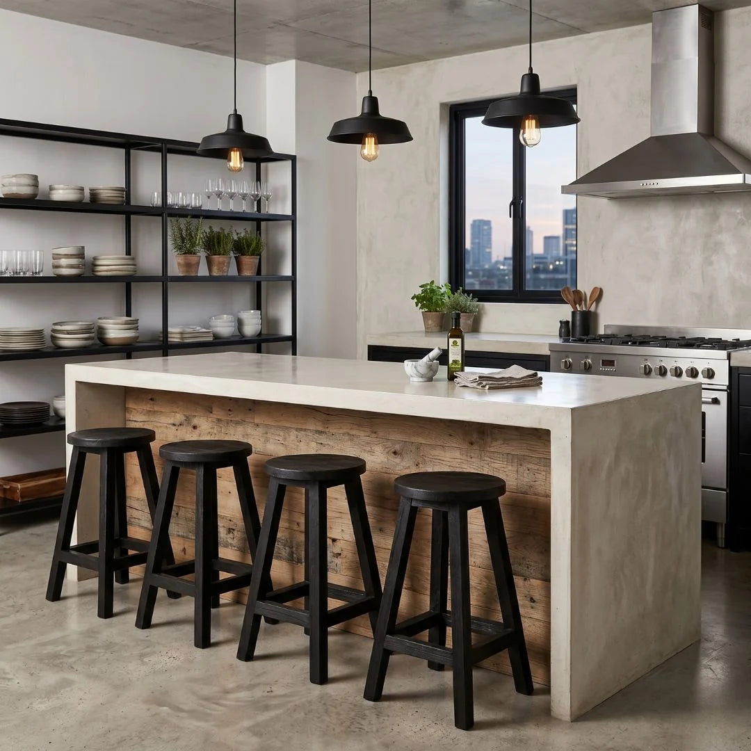 Round black teak stools at a modern industrial kitchen island bench in apartment