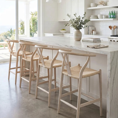 Modern kitchen with marble island and wooden bar stools