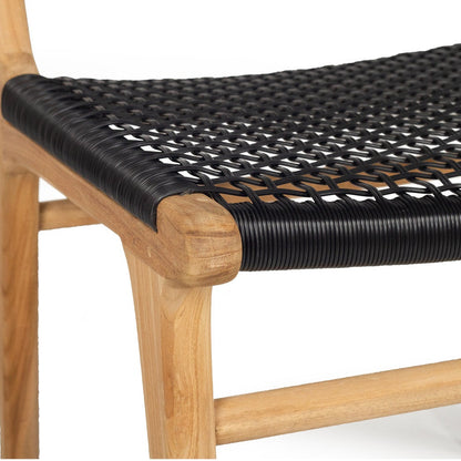 Close-up of a wooden chair with a black woven rope seat on a plain white background.