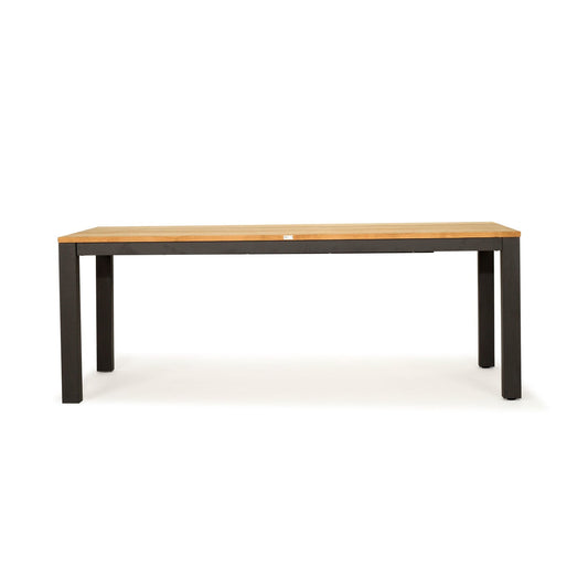 A rectangular table with a light natural wood top and a dark charcoal gray metal frame with four legs, shown against a plain white background.