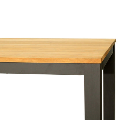 A close-up of a table corner showing a light natural wood top and a dark charcoal gray metal frame leg, isolated on a white background.