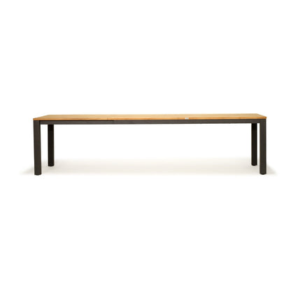 A long rectangular bench with a light natural wood top and dark metal legs, shown against a plain white background.