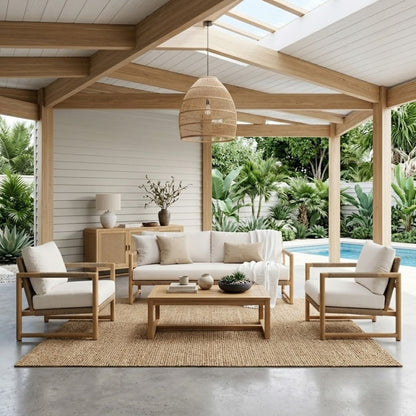 Outdoor patio with wooden furniture, rug, and decorative elements.