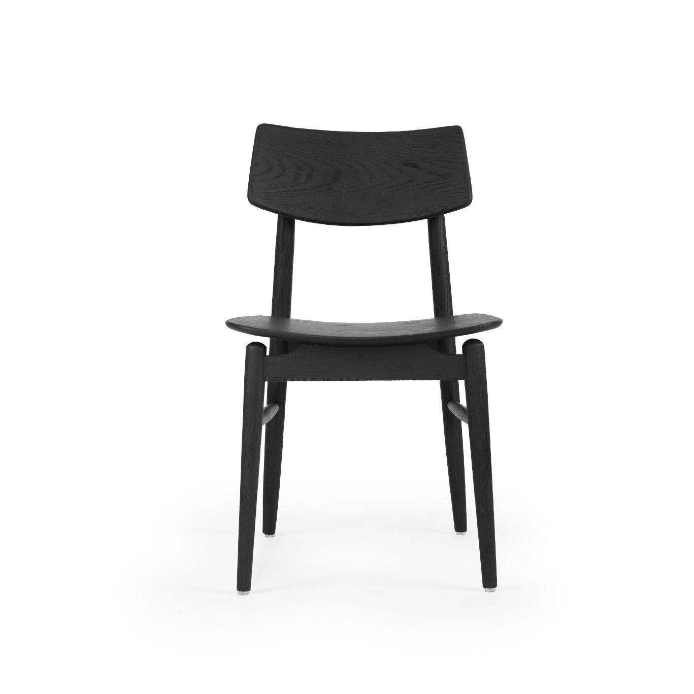 A modern black dining chair with a curved backrest and tapered legs, shown from the front on a solid white background.
