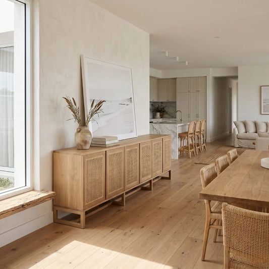 Modern living room with wooden furniture and large windows