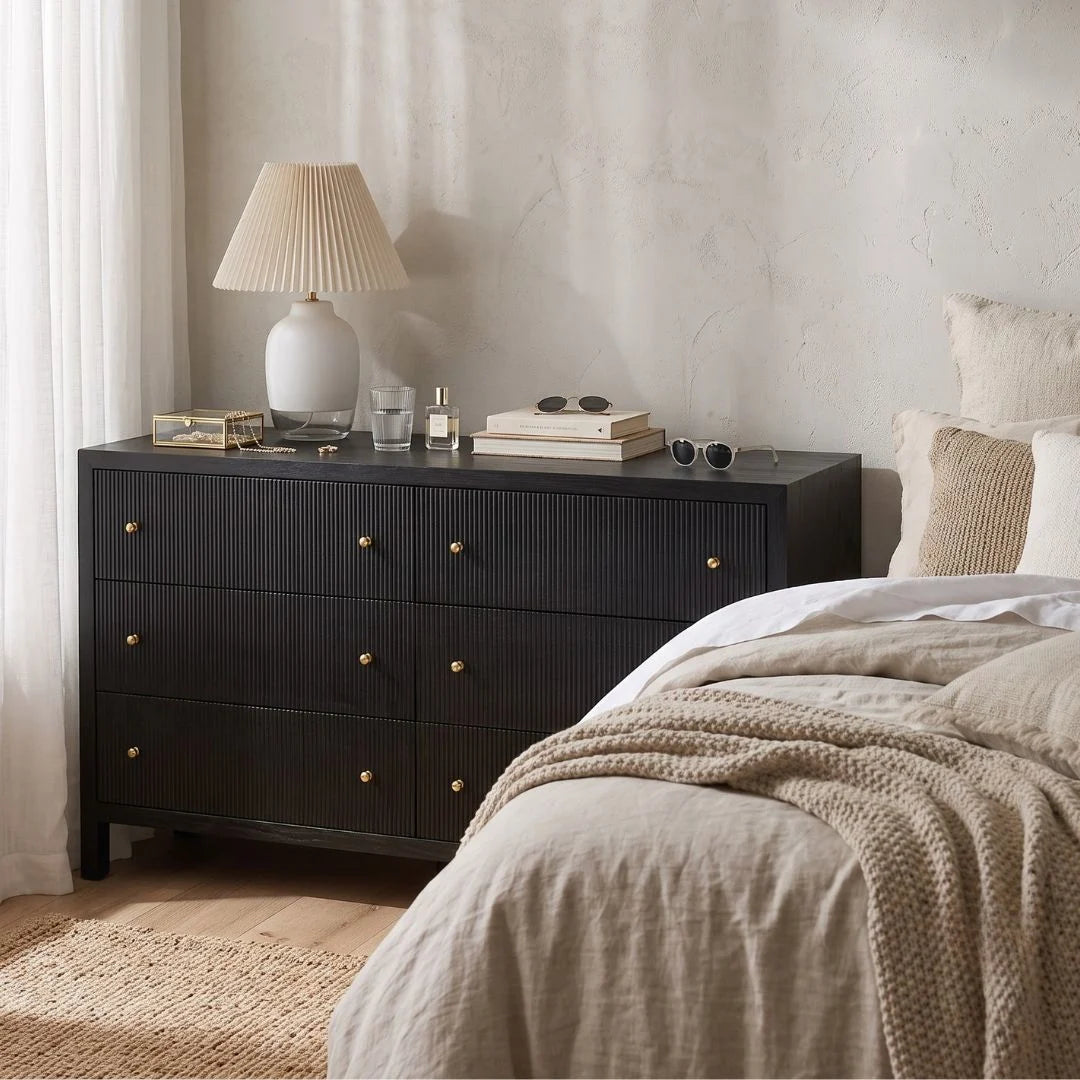 Sun Republic Black chest of drawers styled in a modern bedroom setting