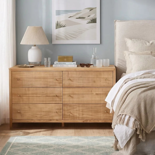 Sun Republic Kingscliff natural teak chest of drawers styled in a modern bedroom setting