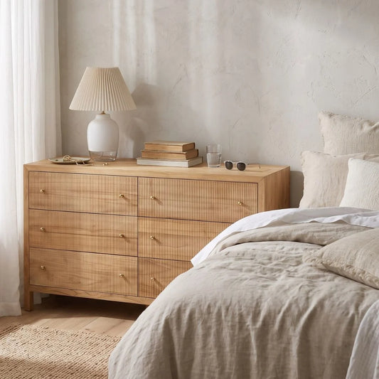 Sun Republic Kingscliff natural teak chest of drawers styled in a modern bedroom setting