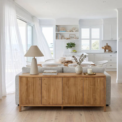 Sun Republic Teak sideboard in a modern living room with a sofa and decor items.