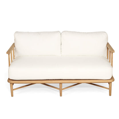 White cushioned sofa with wooden frame on a white background
