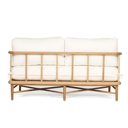White cushioned sofa with wooden frame on a white background