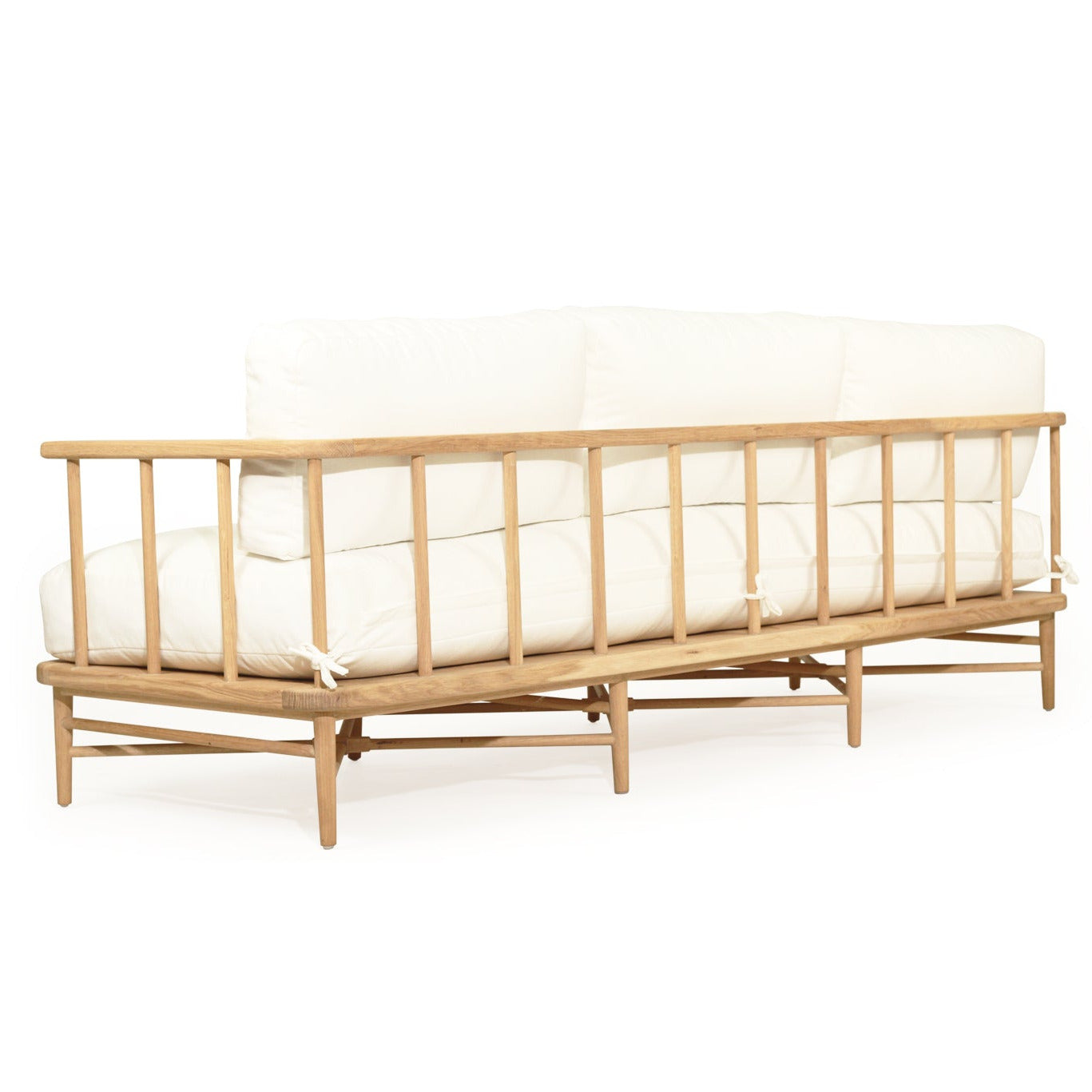 Wooden sofa with white cushions on a white background