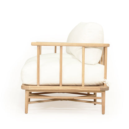 Wooden chair with white cushion on a white background