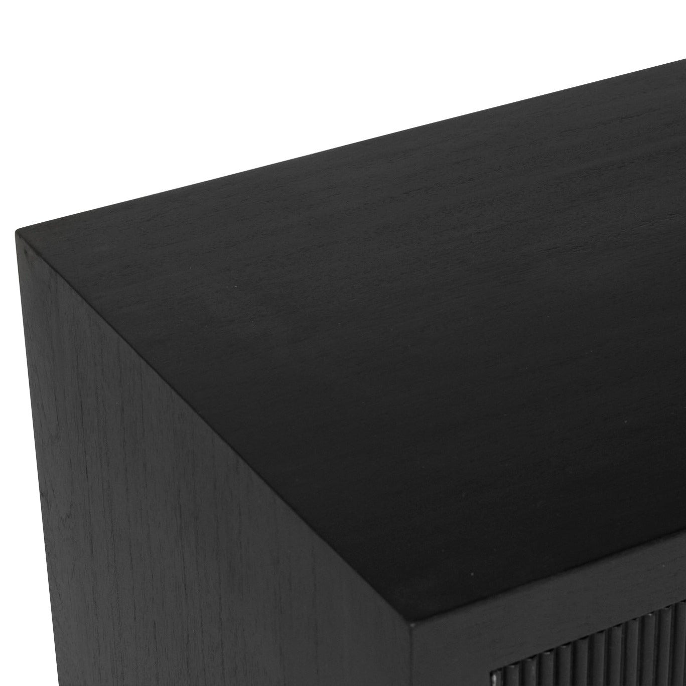 Close-up of a black sideboard with a white background