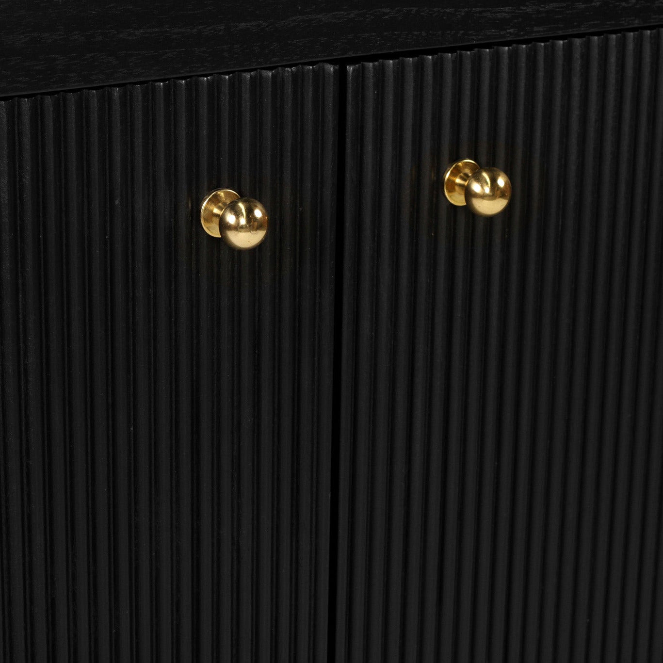 Black textured cabinet with gold handles