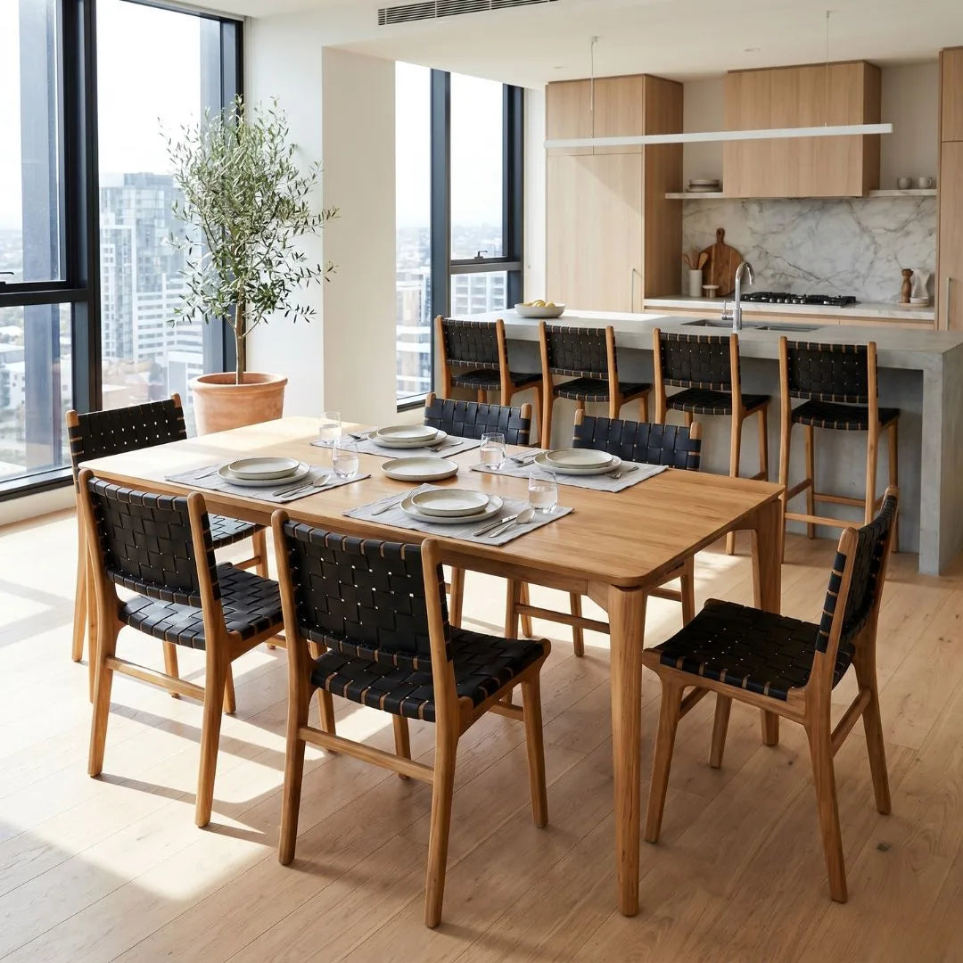 Dining area with wooden table and chairs in a modern kitchen.