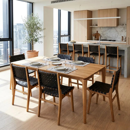 Dining area with wooden table and chairs in a modern kitchen.