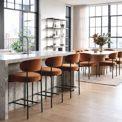 Modern kitchen with marble island and orange bar stools