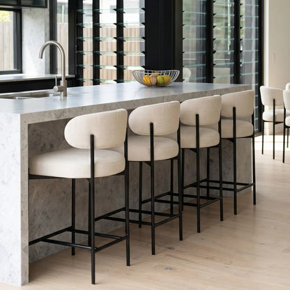 Modern kitchen with marble island and stools