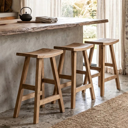 Sun Republic rustic teak counter stool in a row at a kitchen island bench in a modern farmhouse style kitchen