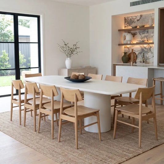 Sun Republic Siena microcement dining table 270cm styled with dining chairs in a modern dining room
