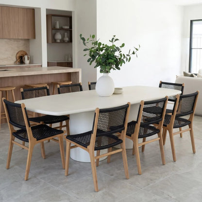 Sun Republic Siena microcement dining table 270cm styled with dining chairs in a modern dining room