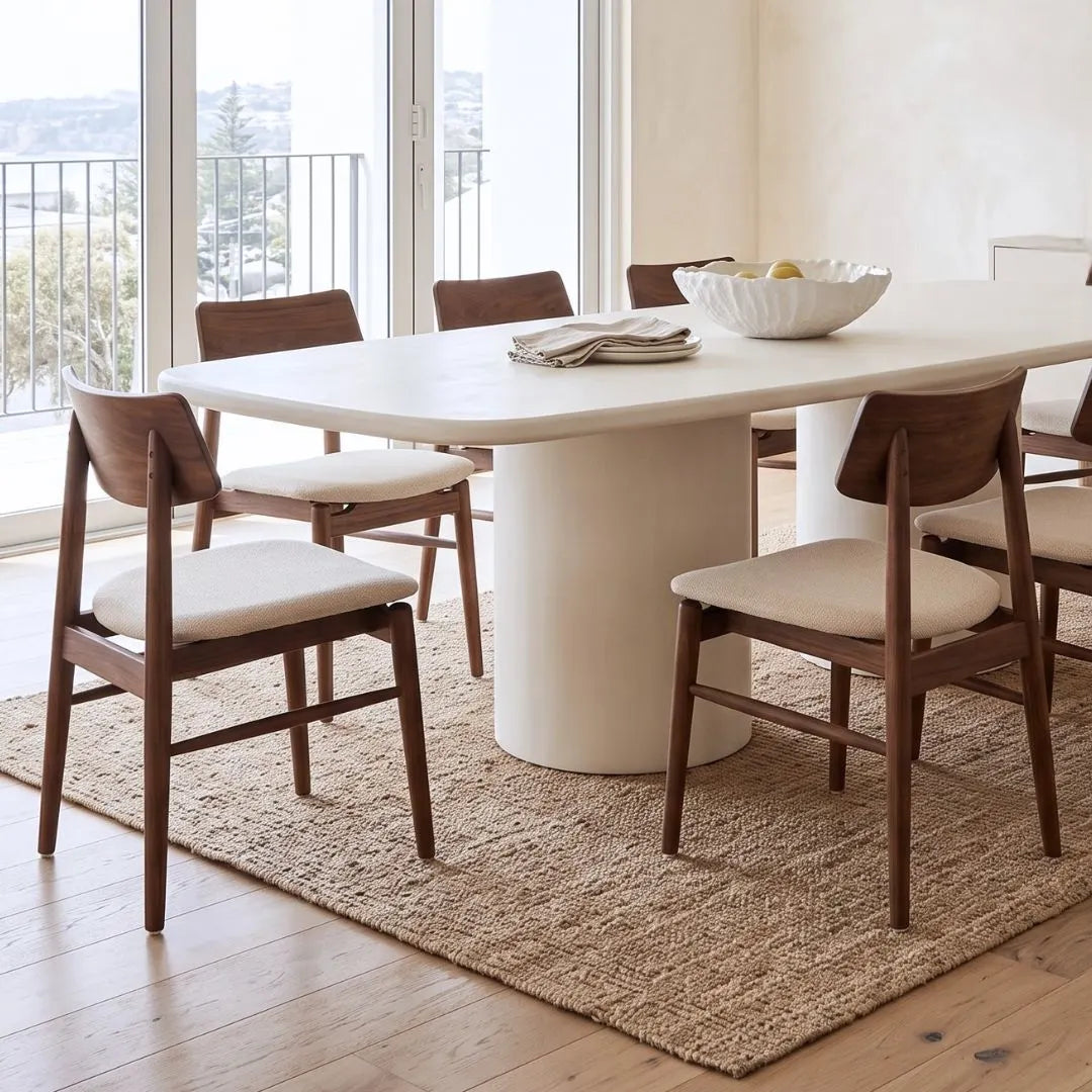 Sun Republic Siena microcement dining table 270cm styled with dining chairs in a modern dining room