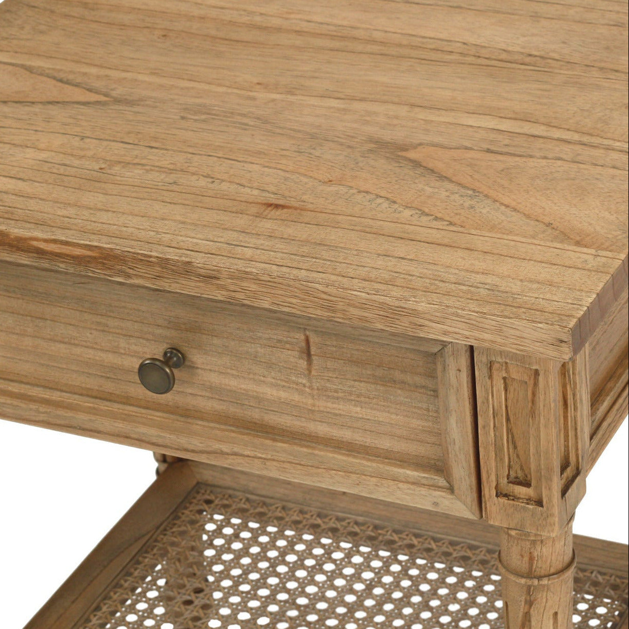 Wooden side table with a single drawer and wicker bottom shelf on a white background