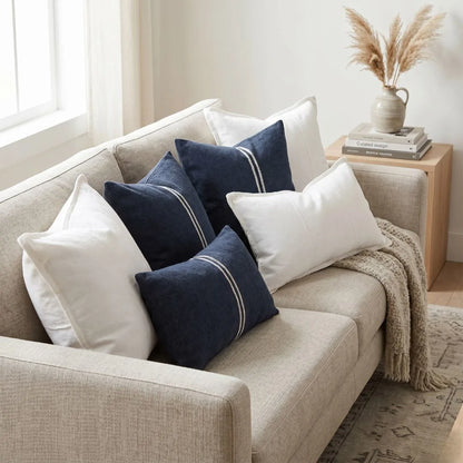 Sun Republic Cushions on a light sofa

