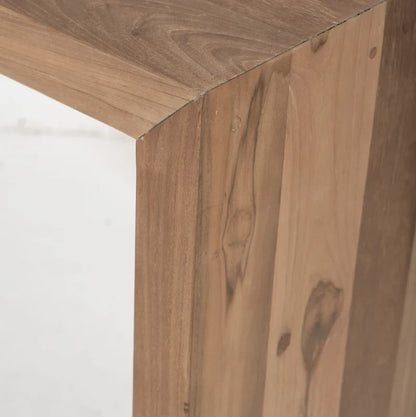 Close-up detail of a wooden furniture corner showing natural wood grain, knots, and plank construction.