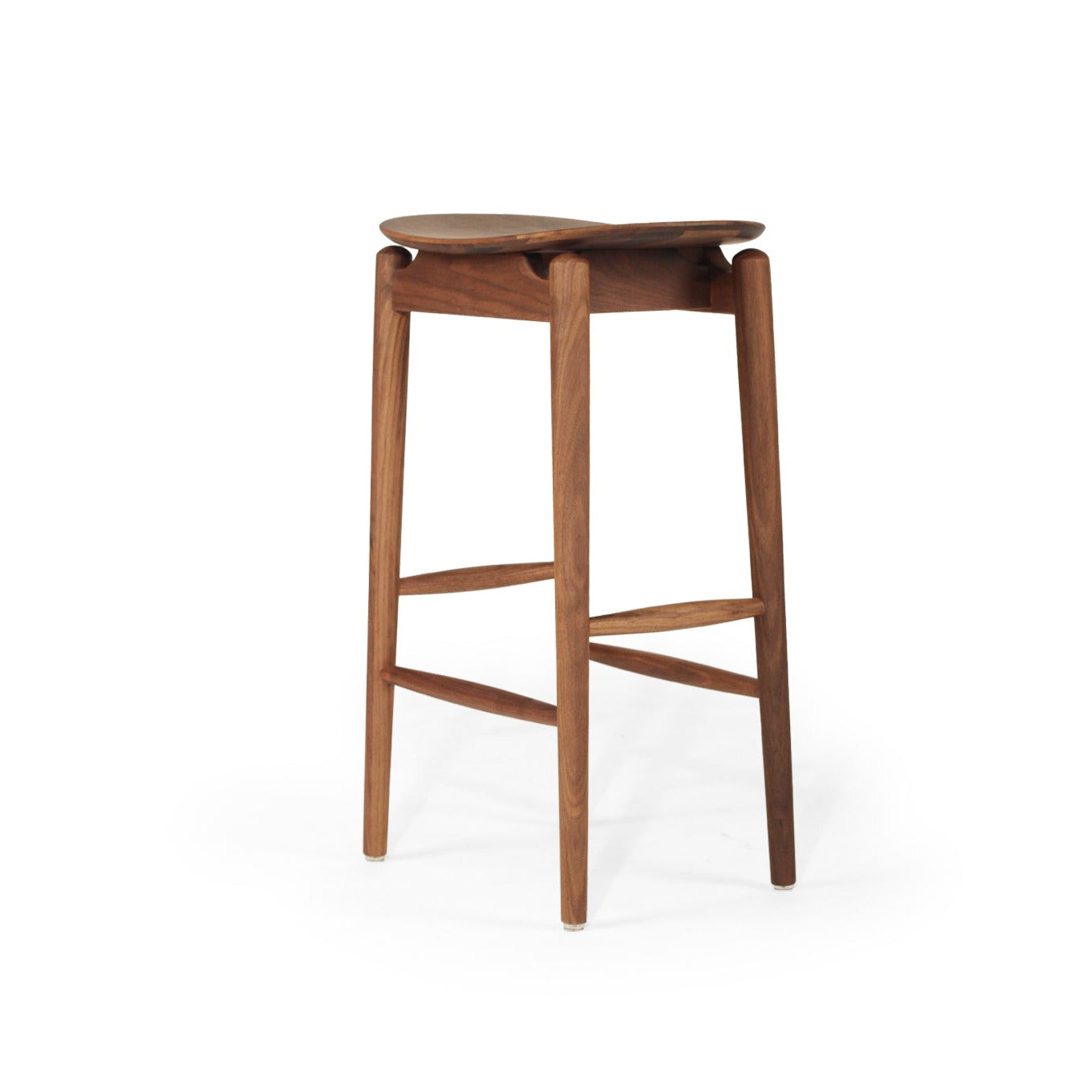 A mid-century modern wooden bar stool with a curved seat, four tapered legs, and two crossed footrests, shown on a plain white background.