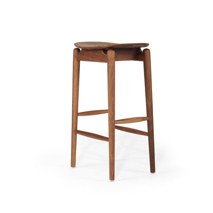 A mid-century modern wooden bar stool with a curved seat, four tapered legs, and two crossed footrests, shown on a plain white background.