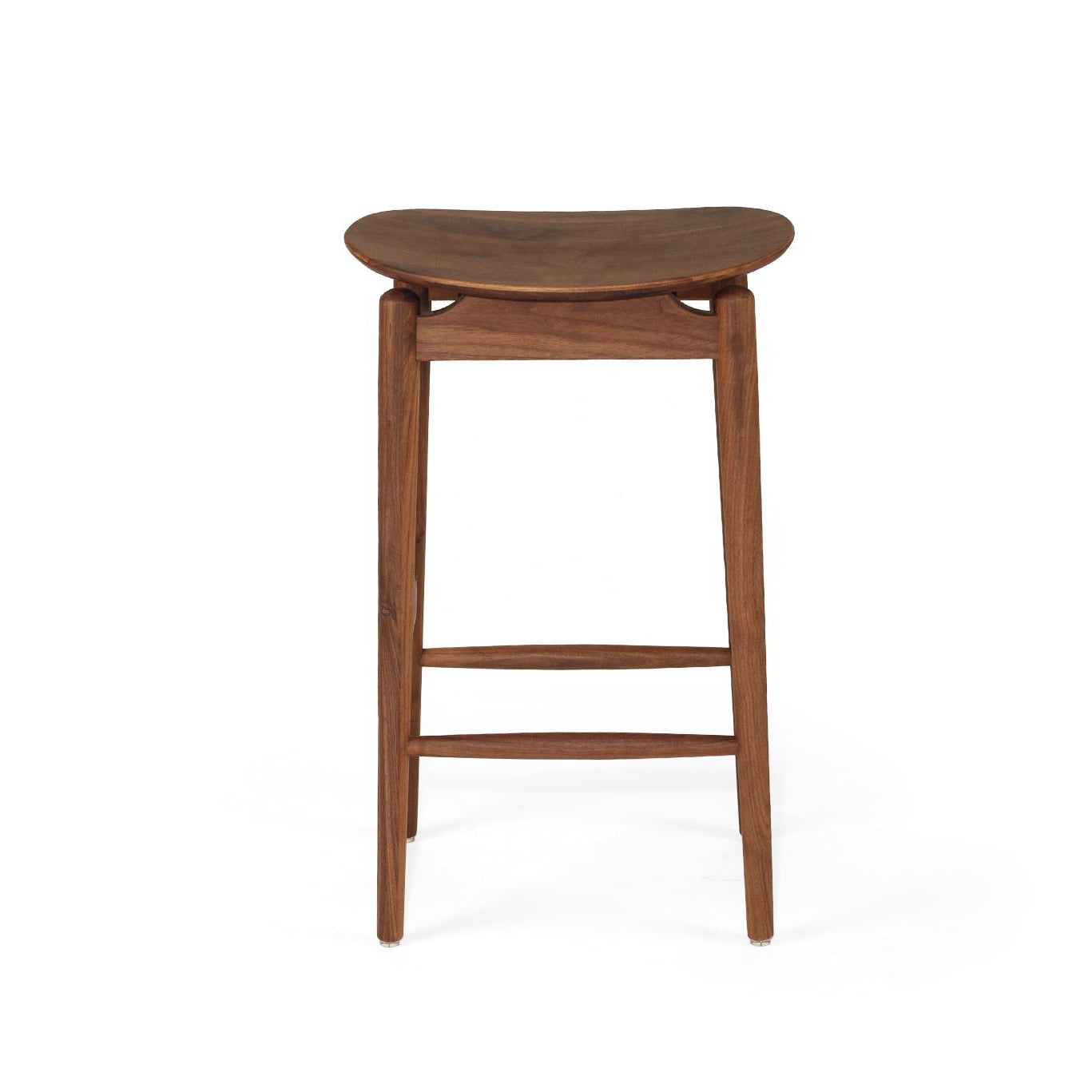 A mid-century modern wooden bar stool with a curved seat, four tapered legs, and a footrest, shown against a plain white background.