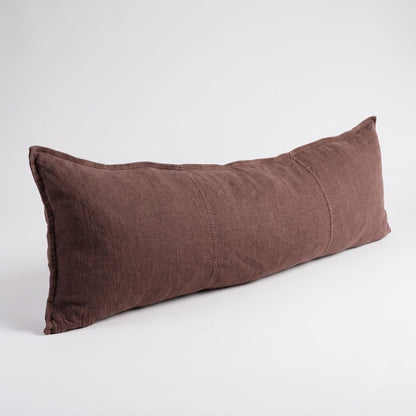 A long, rectangular lumbar pillow in a textured brown linen fabric, photographed on a clean white studio background.