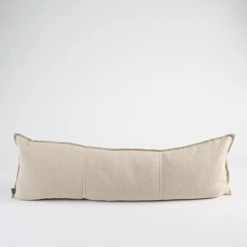 A rectangular lumbar pillow in a light beige linen fabric, shown against a plain white studio background.