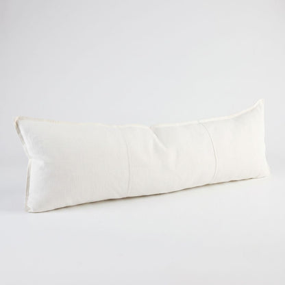 A long, rectangular lumbar pillow in an off-white linen fabric, photographed on a seamless light gray studio background.