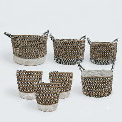 Six woven storage baskets and three matching cylindrical bins with twisted rope handles, shown on a clean white studio background. The baskets feature a brown and black woven body with a natural off-white rope base, while the bins have a brown and black woven body with a natural off-white rope top.