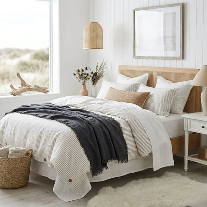 Cozy bedroom with a bed, pillows, and decorative items.