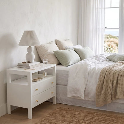 Sun Republic White Kingscliff bedside table in a styled modern bedroom