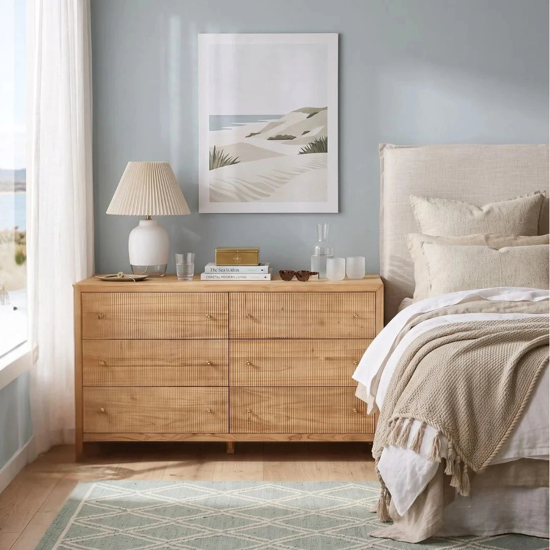 Sun Republic Kingscliff natural teak chest of drawers styled in a modern bedroom setting